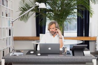 Man focusing at high end standing desk