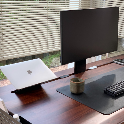 The Tenon Desk from Beflo with a monitor attached to the Basalt Tenon Desk monitor stand