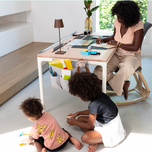 Woman Working while Kids Play